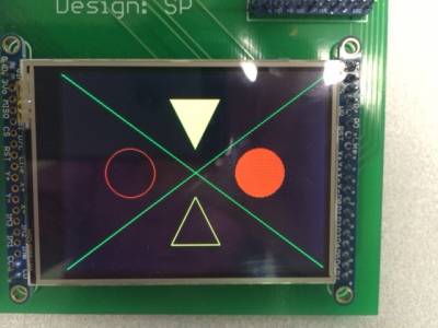 LCD screen showing arrangement of four shapes
